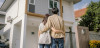 Young couple looking at house