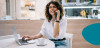 Businesswoman on phone with laptop