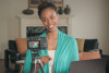 Woman recording video in living room